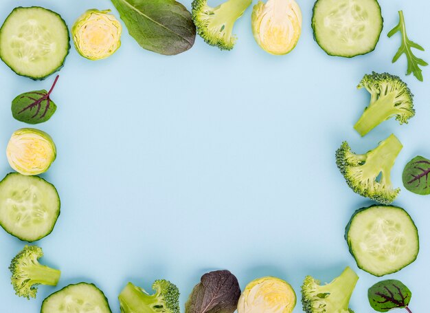 Top view selection of cucumber slices with copy space