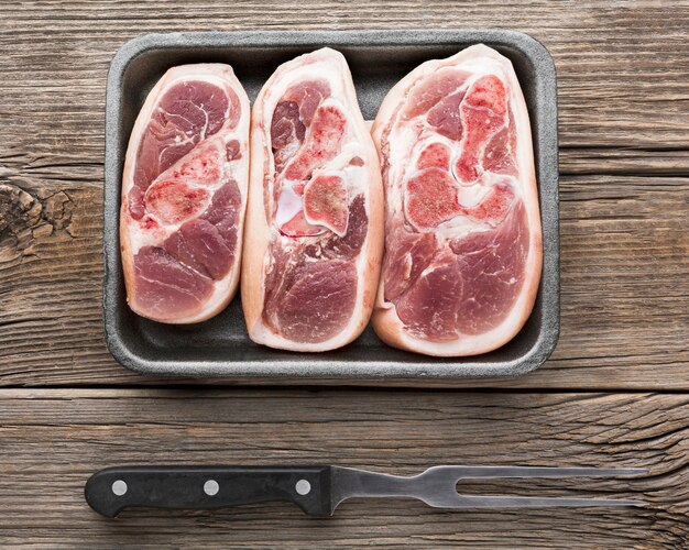 Top view selection of fresh steaks on the table