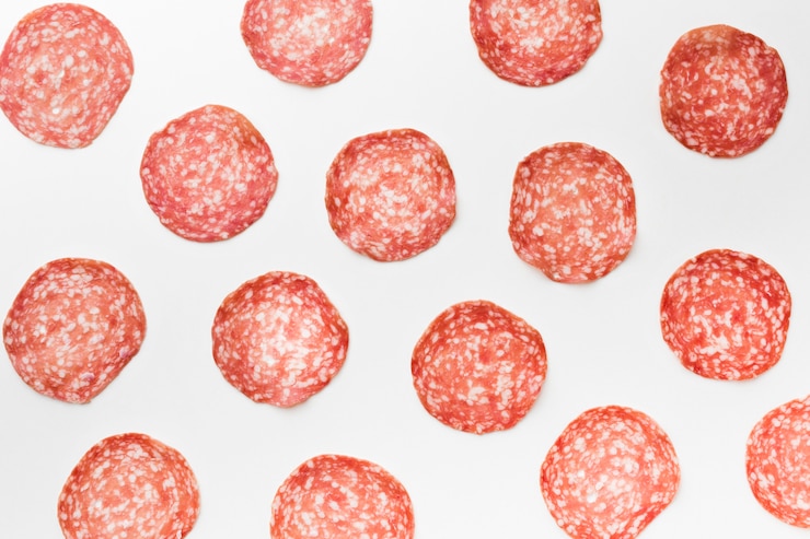 Free Photo top view selection of tasty salami on the table