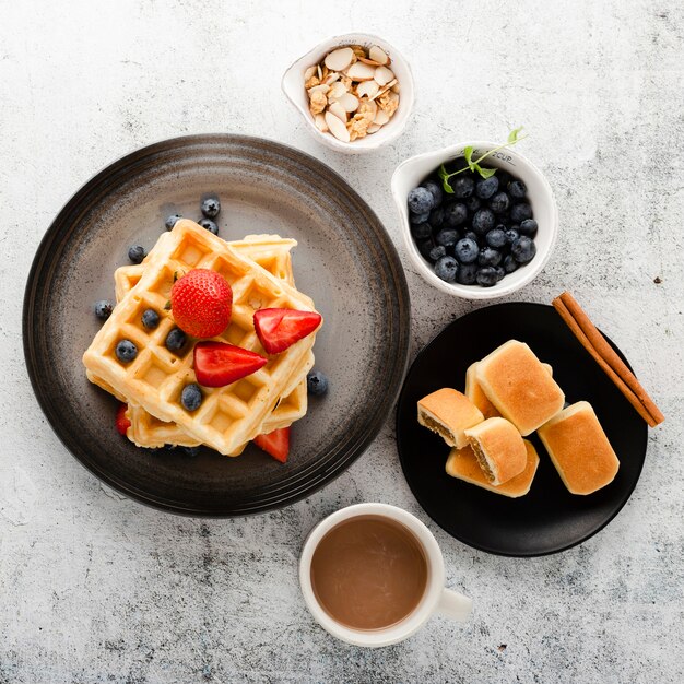 Top view set of pancakes with coffee and fruits