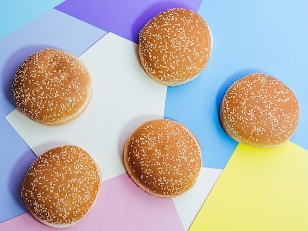 Free photo top view set of tasty buns on colorful background