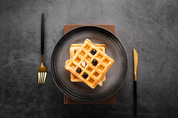 Top view set of two waffles with gold cutlery