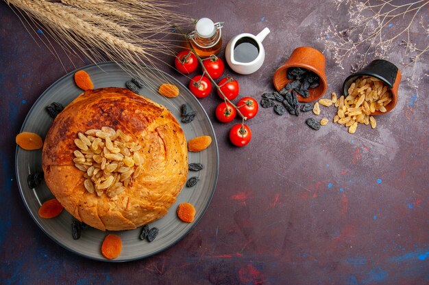 Top view shakh plov eastern meal consists of cooked rice inside round dough on dark background cuisine meal food dough rice