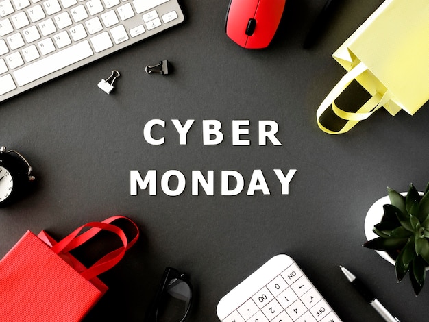 Top view of shopping bags with keyboard and mouse for cyber monday