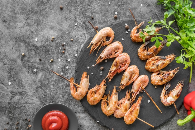 Top view shrimp skewers with sauce