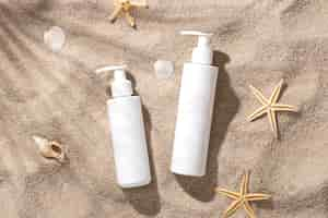 Free photo top view skincare product on the beach