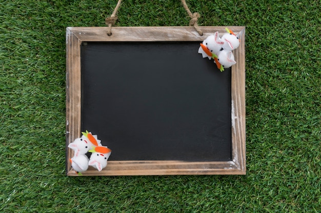 Top view of slate with easter rabbits