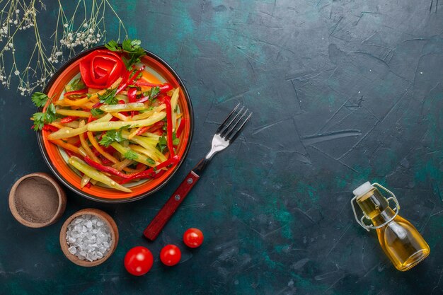 Top view sliced bell-peppers tasty healthy salad with seasonings and olive oil on dark floor