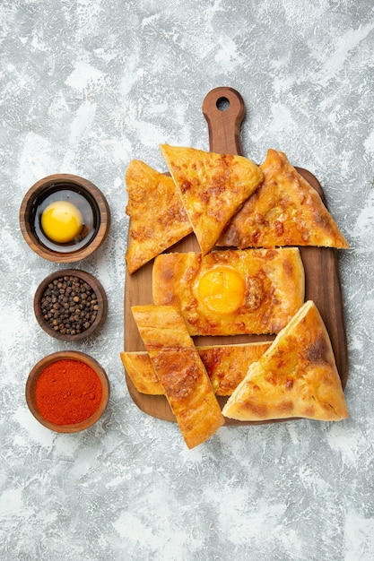 Top view sliced egg bake delicious pastry with seasonings on white background pastry bake dough meal food pizza