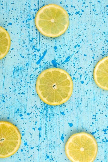 top view sliced lemon sour mellow ripe on the bright blue background