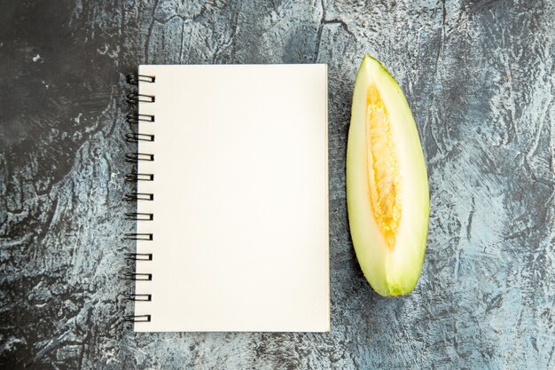 Top view sliced melon on a dark-light table sweet fruit summer mellow