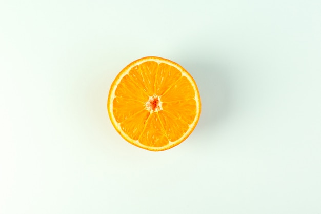 A top view sliced orange fresh ripe juicy mellow isolated piece on the white background fruit color citrus