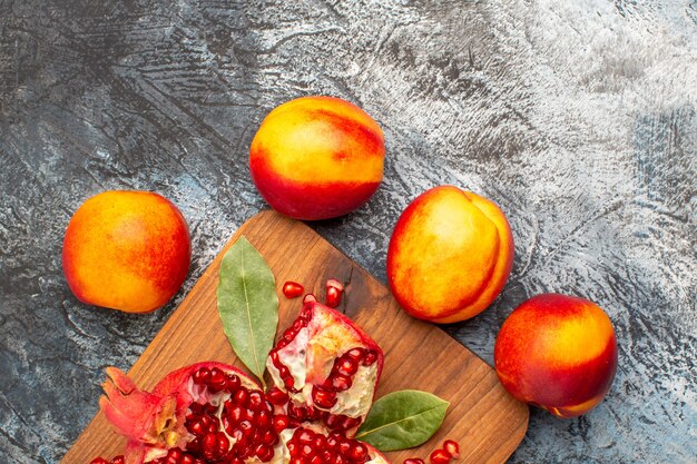 Top view of sliced pomegranates with various ingredients