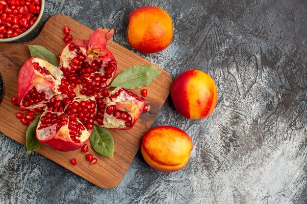 Top view of sliced pomegranates with various ingredients