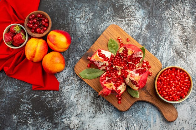 Top view of sliced pomegranates with various ingredients