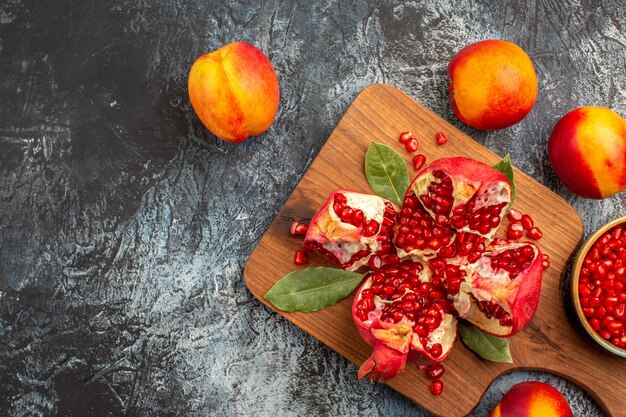 Top view of sliced pomegranates with various ingredients