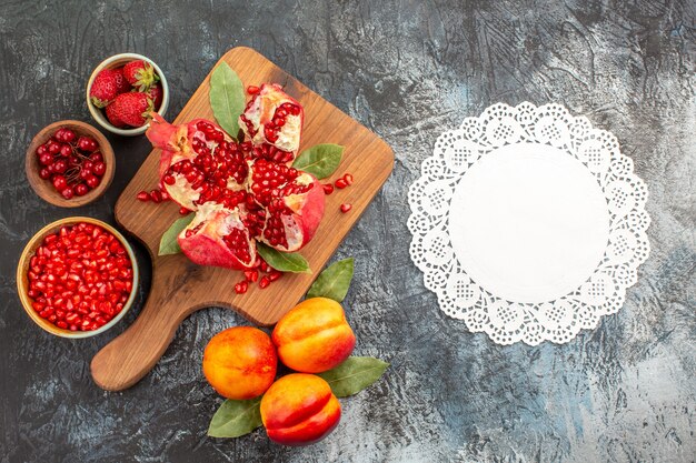 Top view of sliced pomegranates with various ingredients