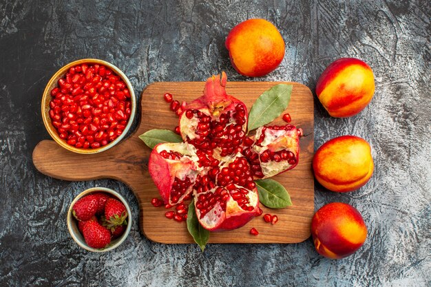 Top view of sliced pomegranates with various ingredients