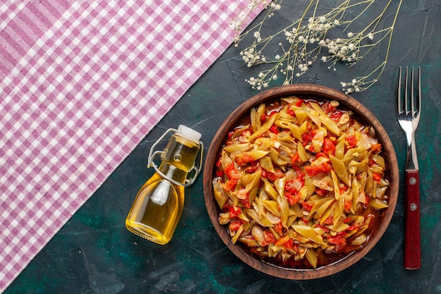 Top view sliced vegetable meal delicious beans meal with olive oil on the blue background