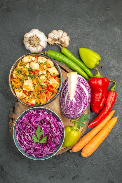 Free photo top view of sliced vegetables with greens