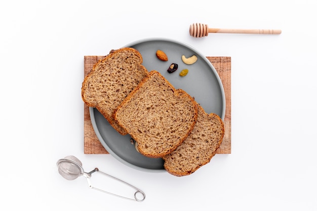 Top view slices of bread on plate and white background