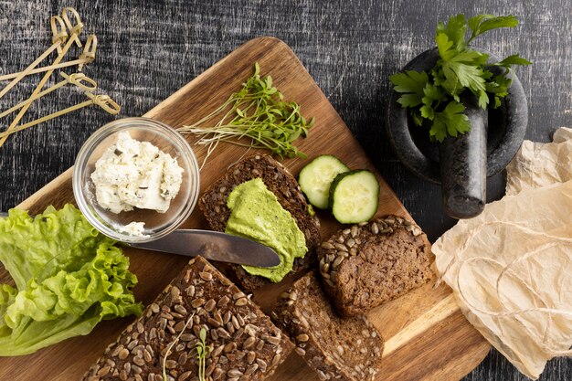 Top view of slices bread for sandwiches with salad