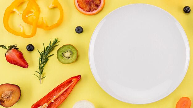 Top view slices of fresh fruit and plate