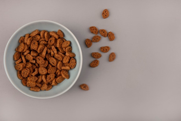 Top view of small rye rusks on a bowl with rusks isolated with copy space