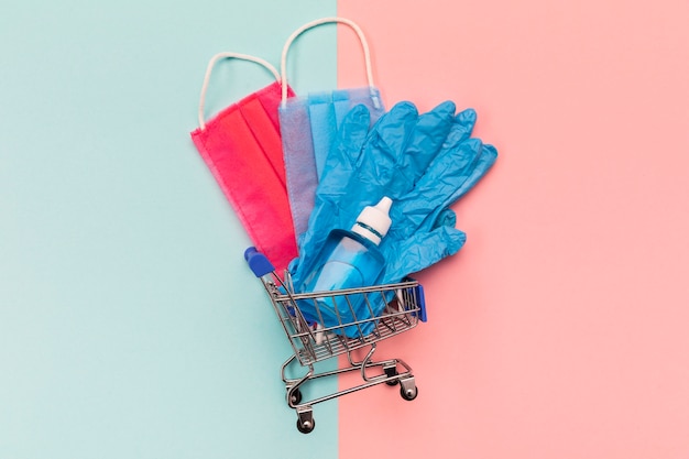 Top view small shopping cart with medical masks