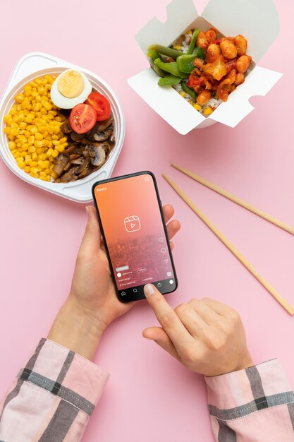 Top view smartphone and delicious food