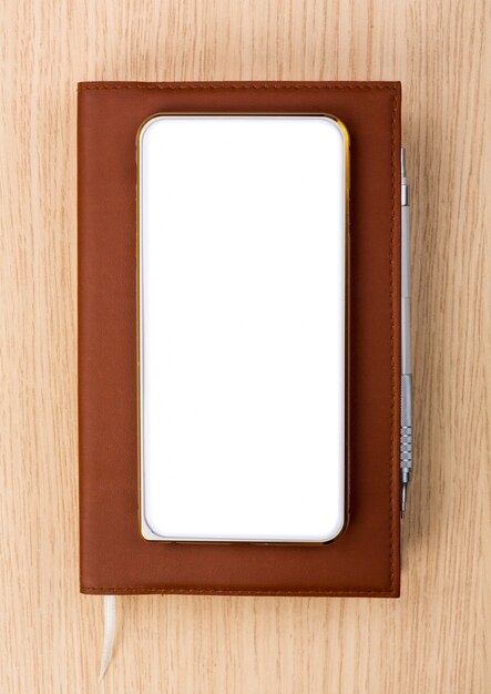 Top view of smartphone on a diary