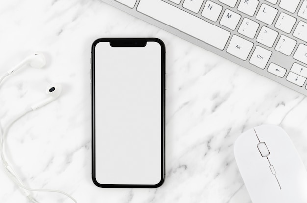 Top view smartphone template over workspace