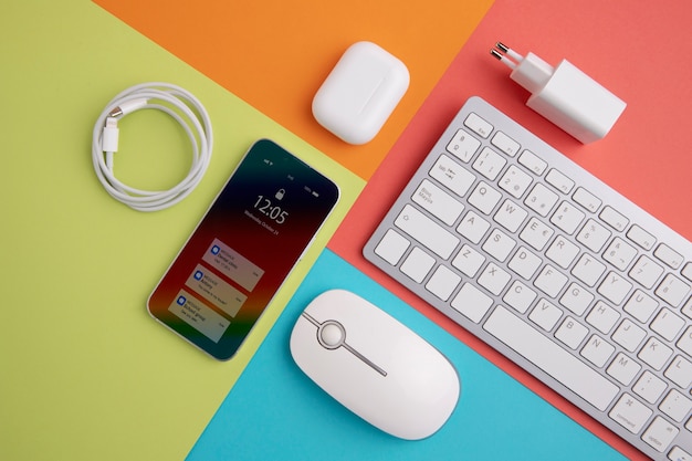 Top view of smartphone with keyboard and charger