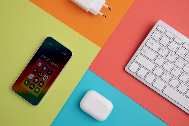 Top view of smartphone with keyboard and charger