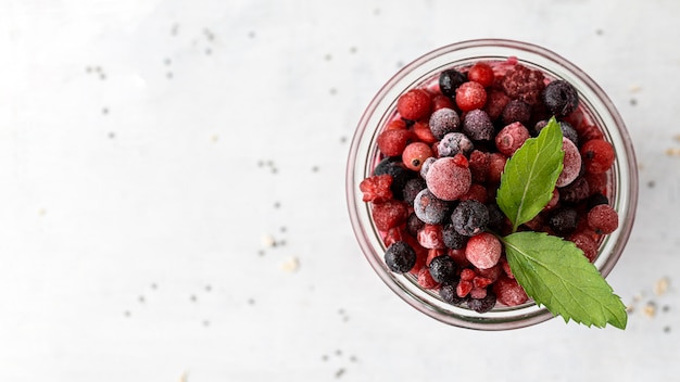 Top view smoothie with frozen fruits