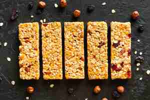 Free photo top view snack bars with dried fruits