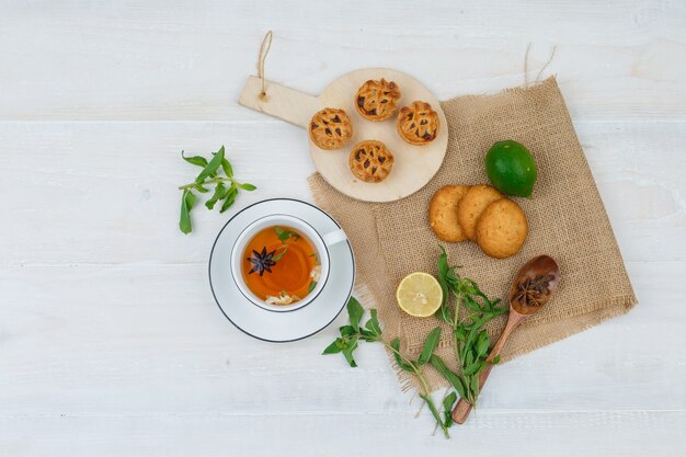 Top view of snacks with herbal tea