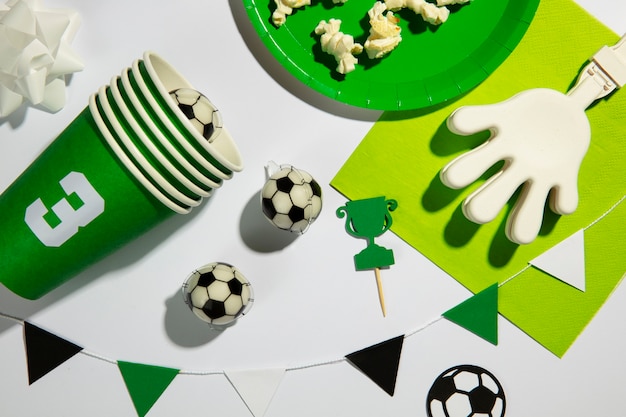 Free photo top view soccer birthday items arrangement