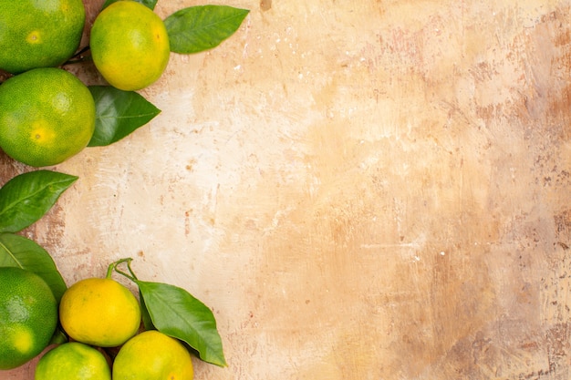 Top view sour green tangerines on light background