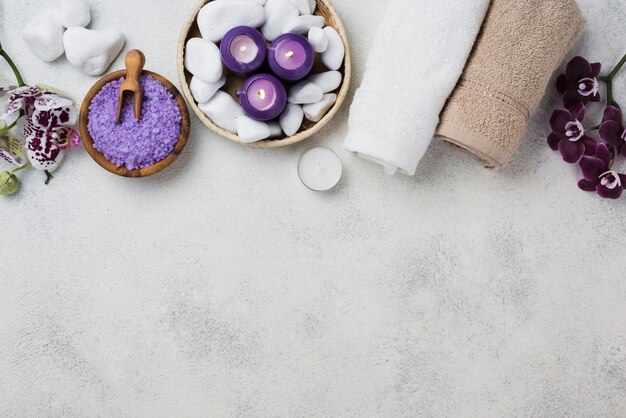 Top view spa towels and candles with copy space
