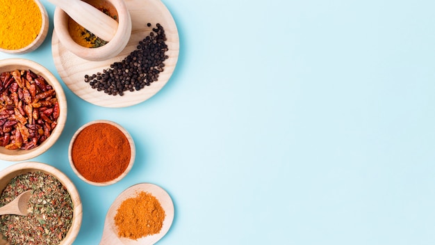 Top view spices on blue background