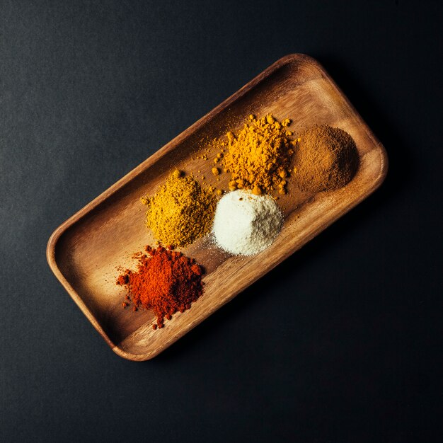 Top view of spices on wooden board