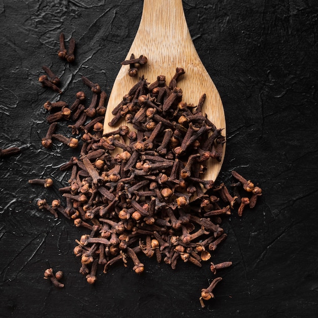 Top view spices on wooden spoon