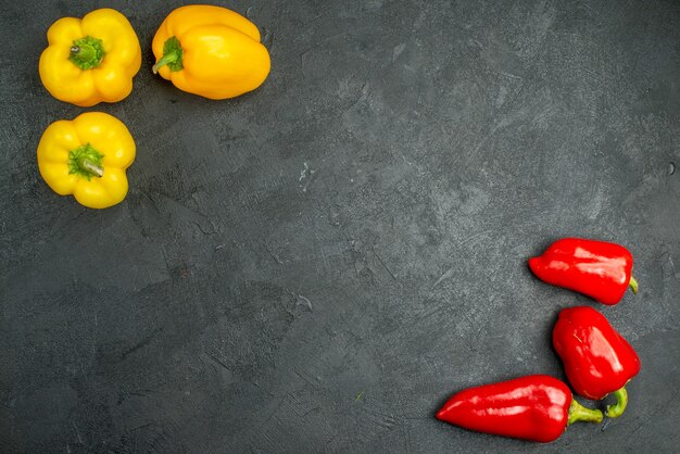 Top view spicy bell-peppers on a dark background