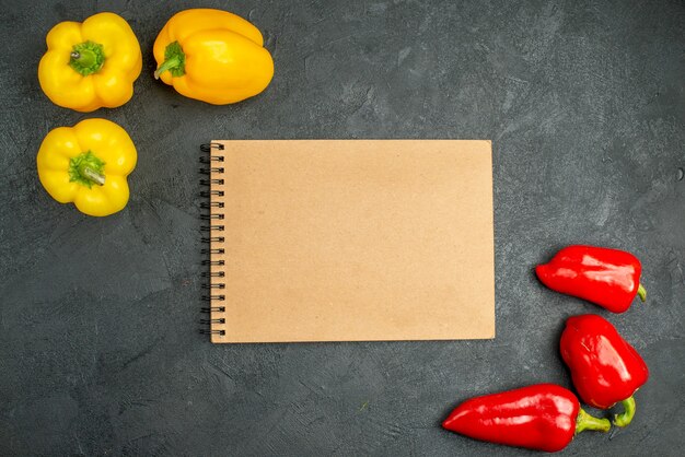 Top view spicy bell-peppers on dark background