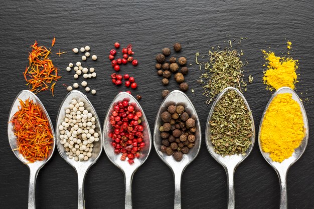 Top view spoons with powder condiments