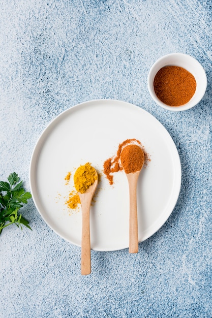 Top view spoons with spices