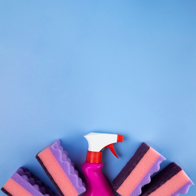 Free photo top view spray bottle and sponges