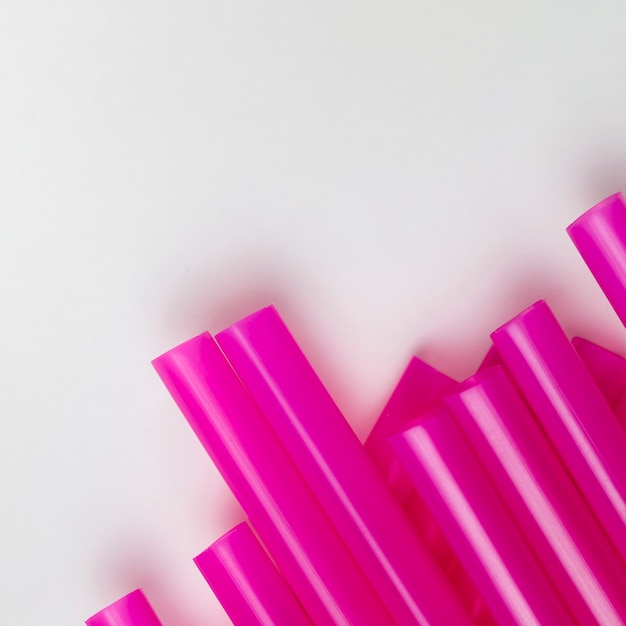 Top view spread purple plastic straws