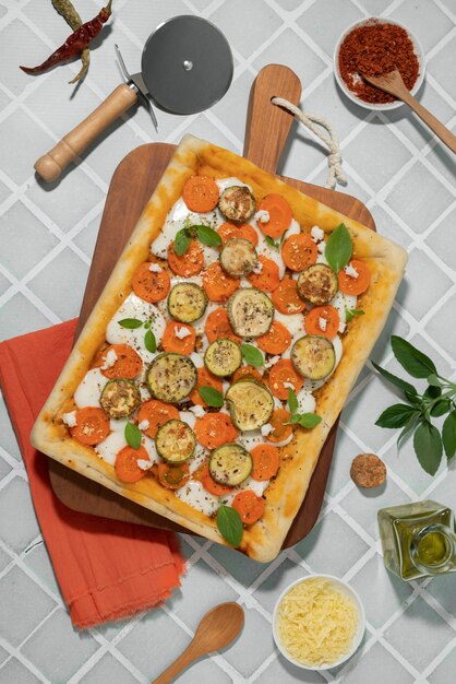 Top view square pizza with vegetables